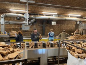 This photo shows a Day Logging processing line for firewood.